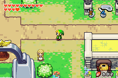 Link walking through Hyrule Town in The Minish Cap.